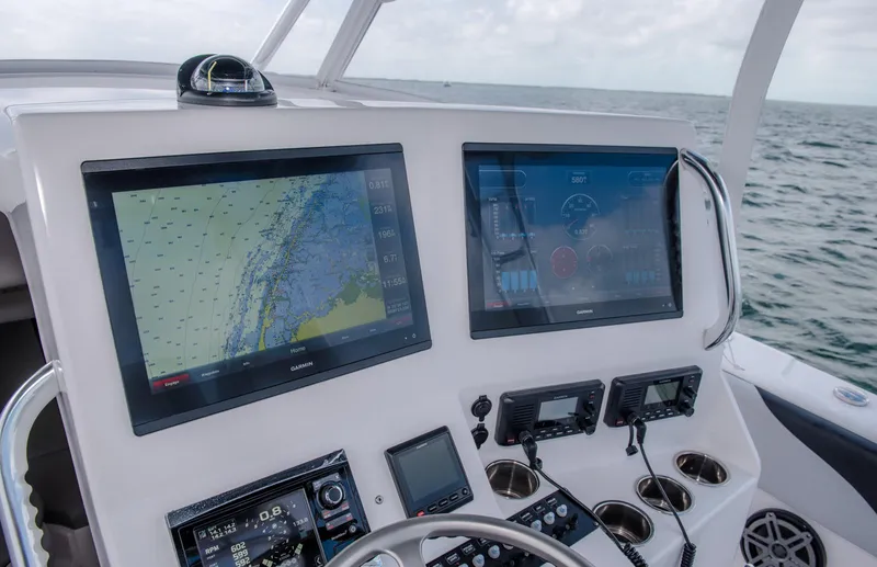 Slide: The Image of 2025 Contender 39 Fisharound helm with dual navigation screens. - 34