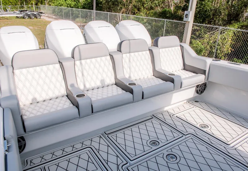 Slide: The Image of 2025 Contender 39 Fisharound boat with luxurious seating and diamond-patterned flooring. - 36