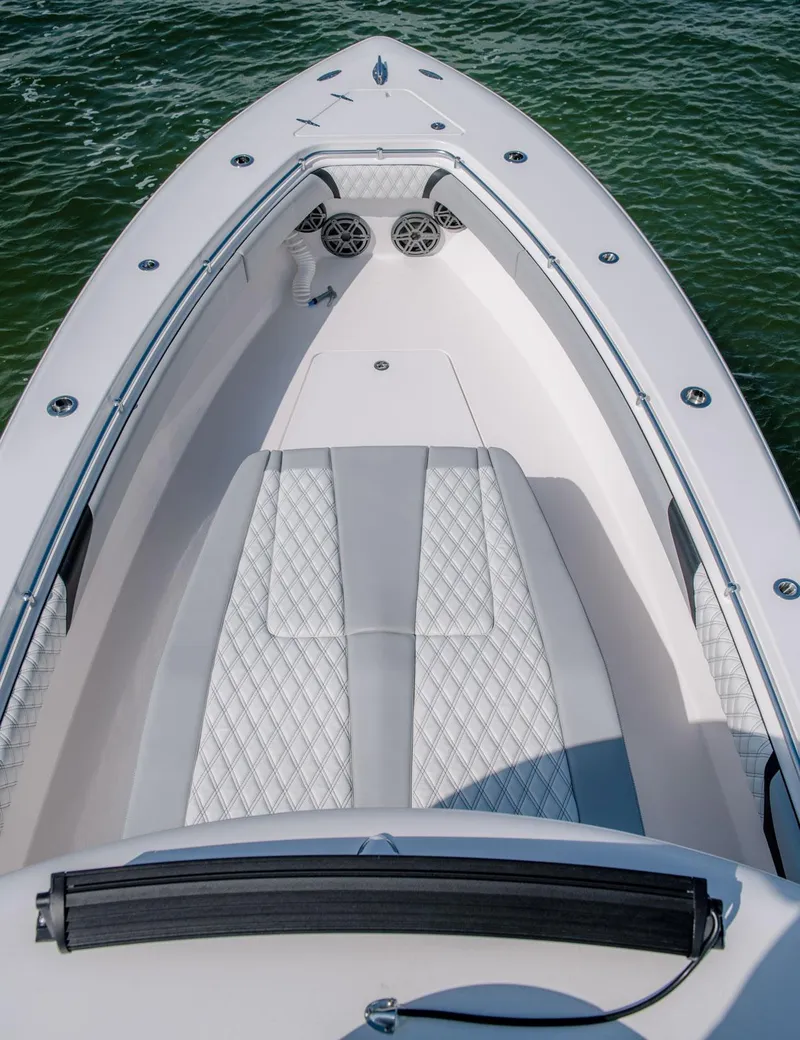 Slide: The Image of 2025 Contender 39 Fisharound boat interior with cushioned seating. - 9