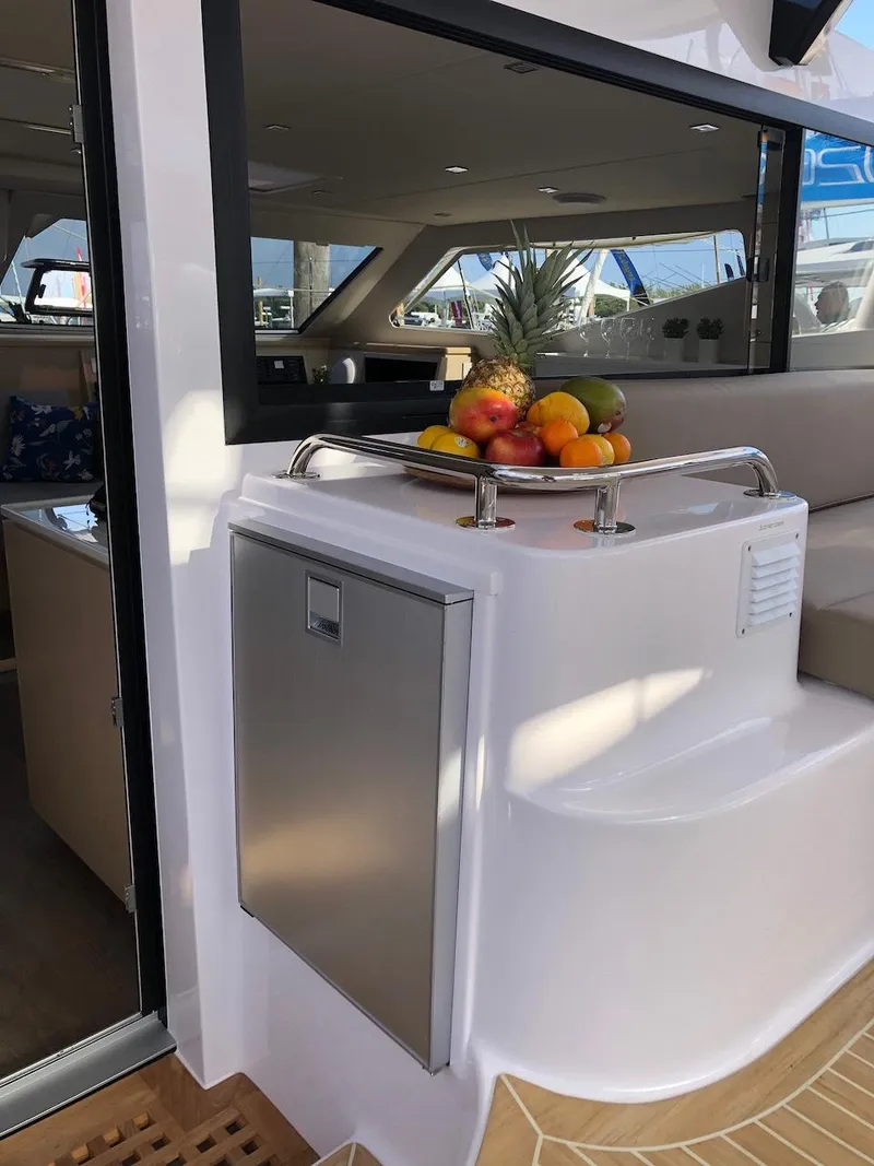 Slide: The Image of 2025 Seawind 1600 yacht interior with fruit bowl on counter. - 10