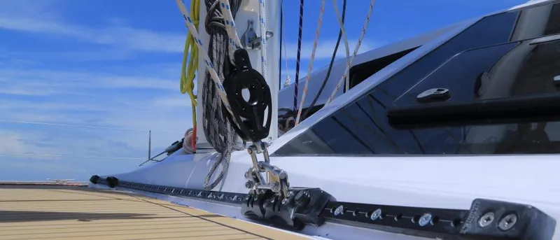 Slide: The Image of 2025 Seawind 1600 yacht deck with rigging against blue sky. - 34