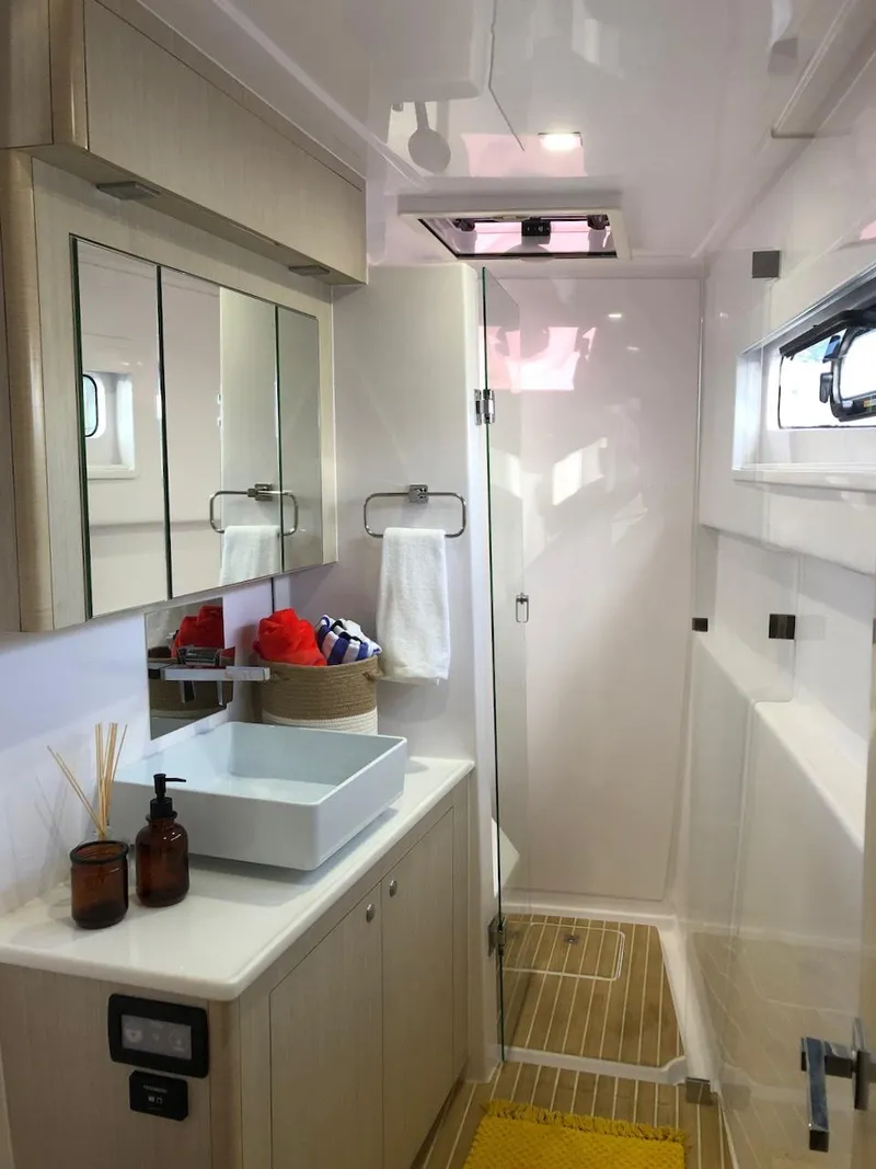 Slide: The Image of Luxurious bathroom in 2025 Seawind 1600 yacht with modern fixtures and elegant design. - 4