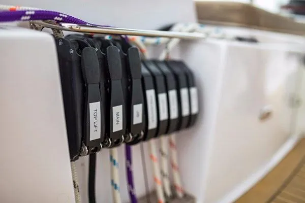 Slide: The Image of Control panel of a 2025 Seawind 1600 sailboat with labeled ropes and levers. - 40