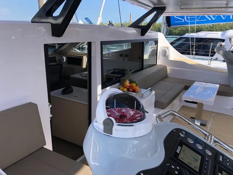 Slide: The Image of Luxurious 2025 Seawind 1600 yacht interior with modern seating and navigation equipment. - 5