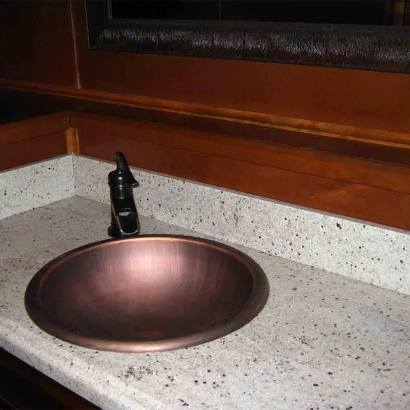Slide: The Image of Copper sink with black faucet on speckled countertop in 2011 Bravada Dreamweaver Trip #2. - 11