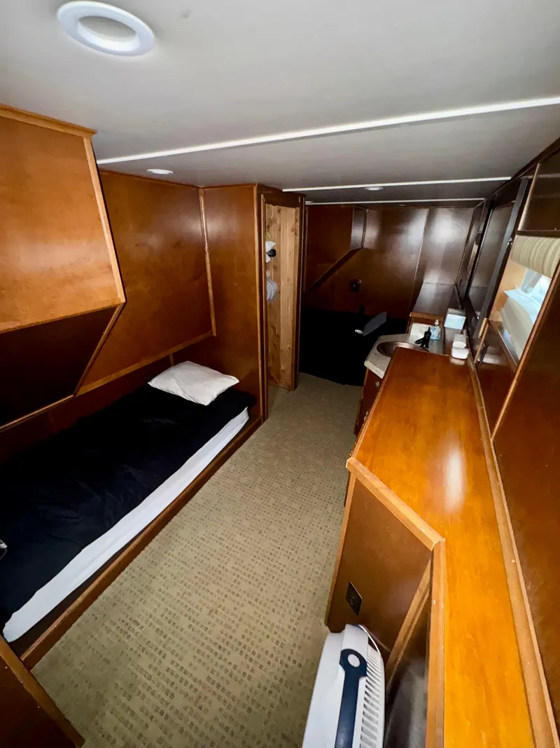 Slide: The Image of Interior of 2011 Bravada Dreamweaver Trip #2 with wooden furnishings and cozy sleeping area. - 20