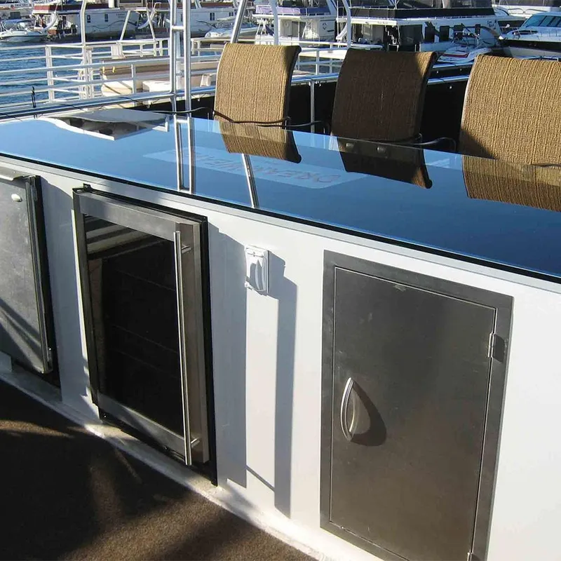 Slide: The Image of Luxurious 2011 Bravada Dreamweaver yacht deck with sleek cabinetry and elegant seating. - 28