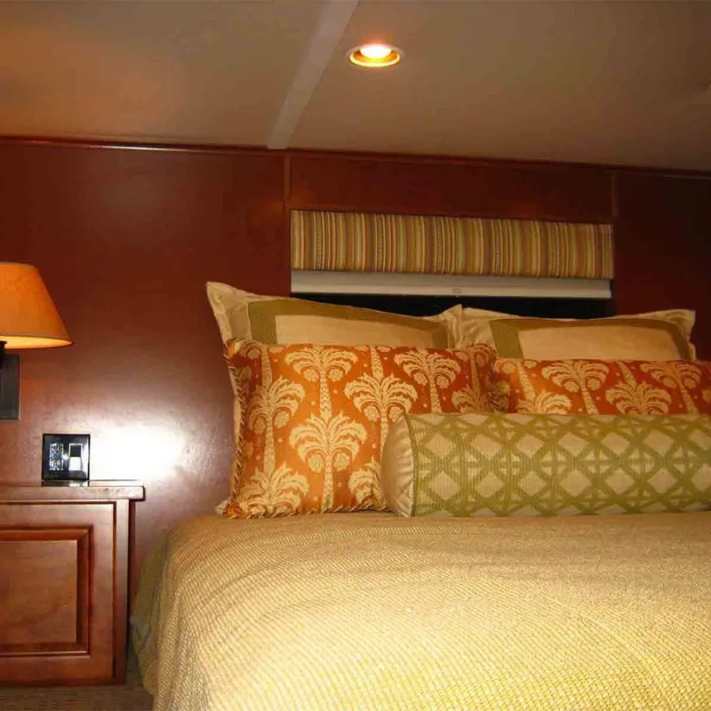 Slide: The Image of Luxurious bedroom interior in 2011 Bravada Dreamweaver Trip #2 with elegant bedding and warm lighting. - 5