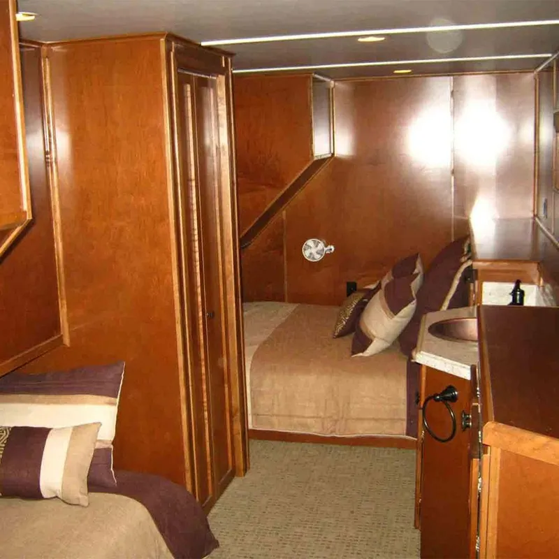 Slide: The Image of Luxurious wooden interior of 2011 Bravada Dreamweaver Trip #2 with cozy bedding and sink. - 7