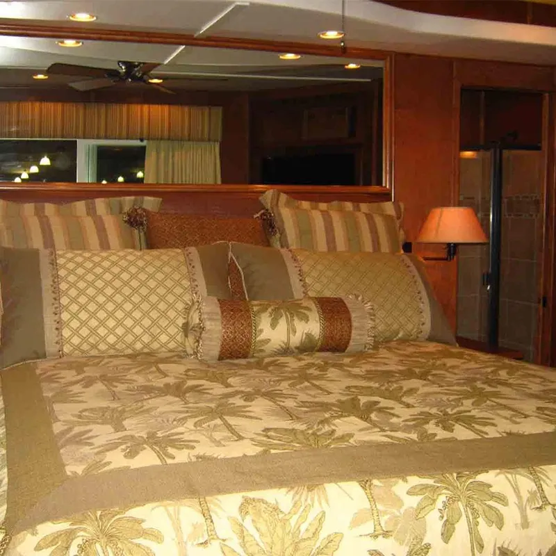 Slide: The Image of Luxurious bedroom interior in 2011 Bravada Dreamweaver Trip #2, featuring elegant bedding and warm lighting. - 8