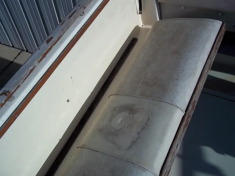 Slide: The Image of Worn seat cushion on a 1984 Sea Ray SRV 260 Sundancer boat. - 15