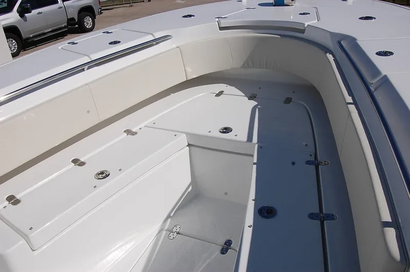 Slide: The Image of 2025 Cape Horn 32 XS boat interior with spacious seating and storage compartments. - 10
