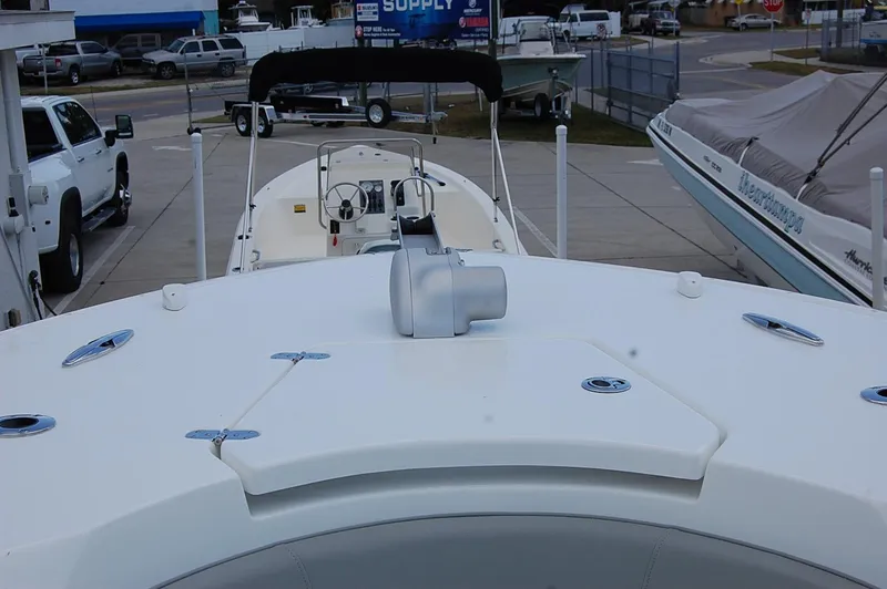 Slide: The Image of 2025 Cape Horn 32 XS boat, view of the bow and cockpit area in a marina. - 18
