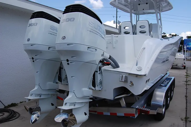Slide: The Image of 2025 Cape Horn 32 XS boat with twin 300 horsepower engines on trailer. - 22