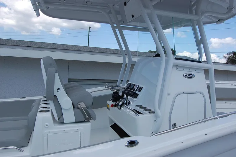 Slide: The Image of 2025 Cape Horn 32 XS center console boat with modern helm and seating. - 27