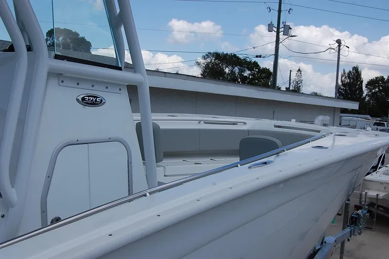 Slide: The Image of 2025 Cape Horn 32 XS boat, white exterior, docked, side view. - 28