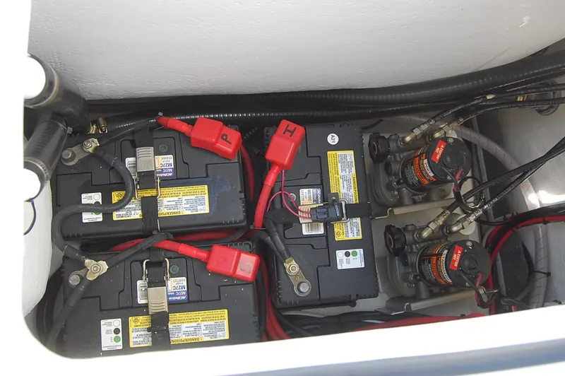 Slide: The Image of Battery compartment of 2025 Cape Horn 32 XS boat with wiring and connections. - 3