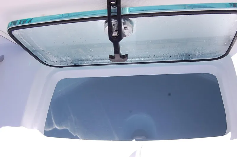 Slide: The Image of Cape Horn 32 XS 2025 model boat storage compartment with a transparent lid. - 6