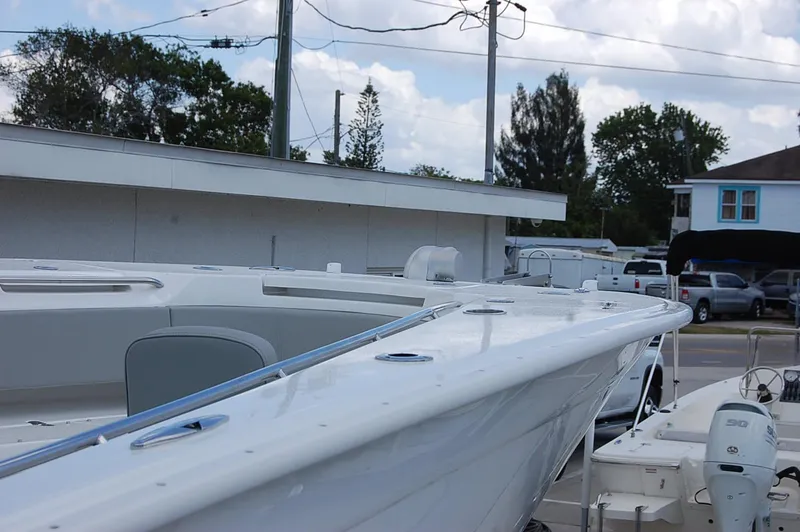 Slide: The Image of 2025 Cape Horn 32 XS boat docked at a marina. - 13