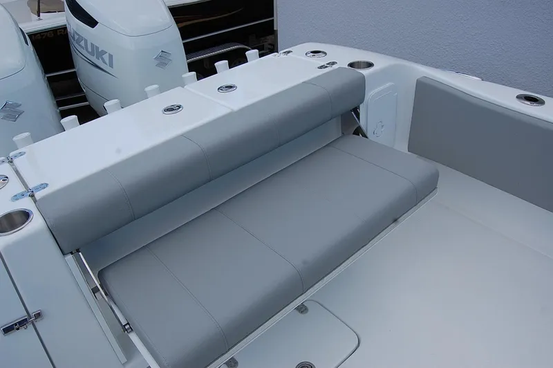 Slide: The Image of 2025 Cape Horn 32 XS boat with Suzuki engines and cushioned seating. - 15