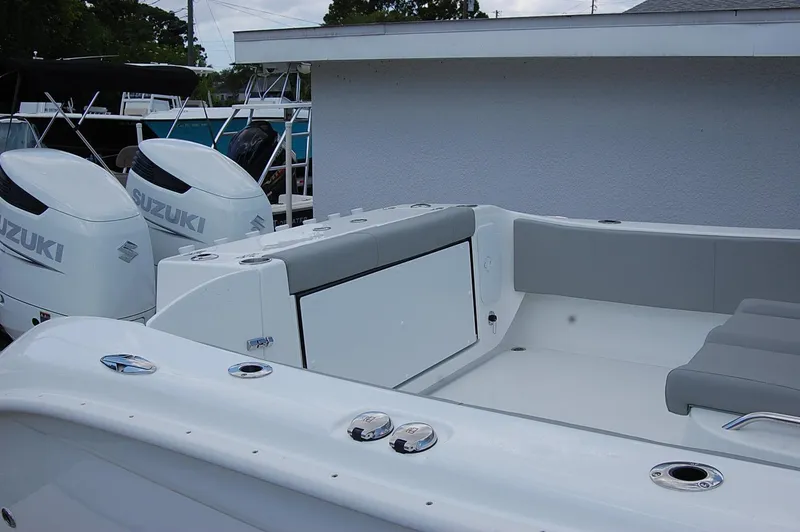 Slide: The Image of 2025 Cape Horn 32 XS boat with Suzuki engines, rear seating area. - 25