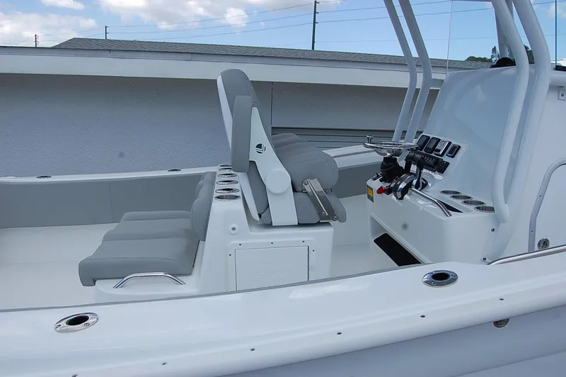 Slide: The Image of 2025 Cape Horn 32 XS boat interior with seating and control panel. - 26
