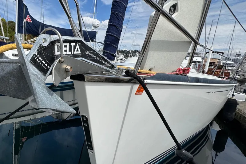 Slide: The Image of Sailboat docked with Delta anchor, C&C 110 model, 2004, in marina setting. - 11