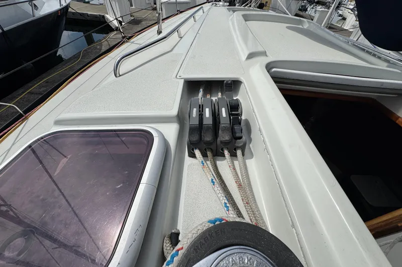 Slide: The Image of Deck of 2004 C&C 110 sailboat with rope clutches and hatch. - 12