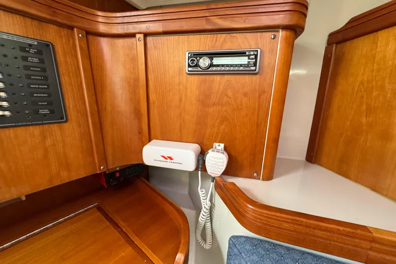 Slide: The Image of Wooden interior of a 2004 C&C 110 yacht with control panel and radio. - 26