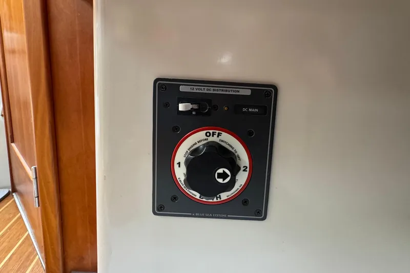 Slide: The Image of 12V DC distribution panel on a 2004 C&C 110 boat, featuring a main switch. - 27