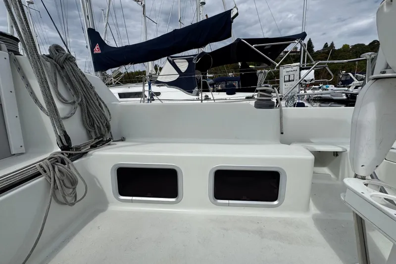 Slide: The Image of Sailboat cockpit of a 2004 C&C 110, featuring ropes and seating area. - 5