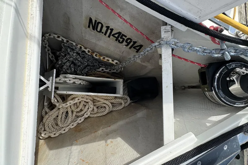 Slide: The Image of Anchor and ropes in a C&C 110 sailboat compartment, model year 2004. - 8