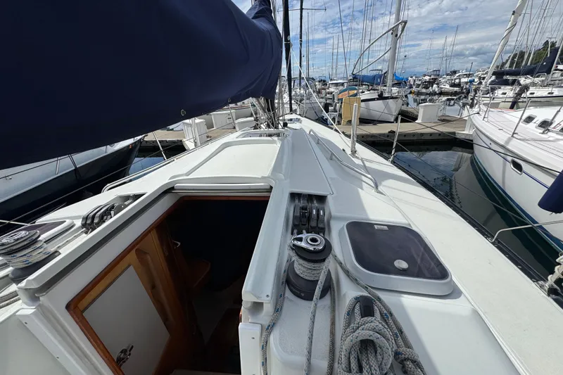 Slide: The Image of Sailboat deck view of 2004 C&C 110 model, docked in a marina. - 9