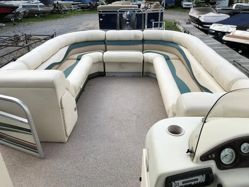 Slide: The Image of 2001 Bennington 2250 RL pontoon boat with spacious seating and neutral upholstery. - 7