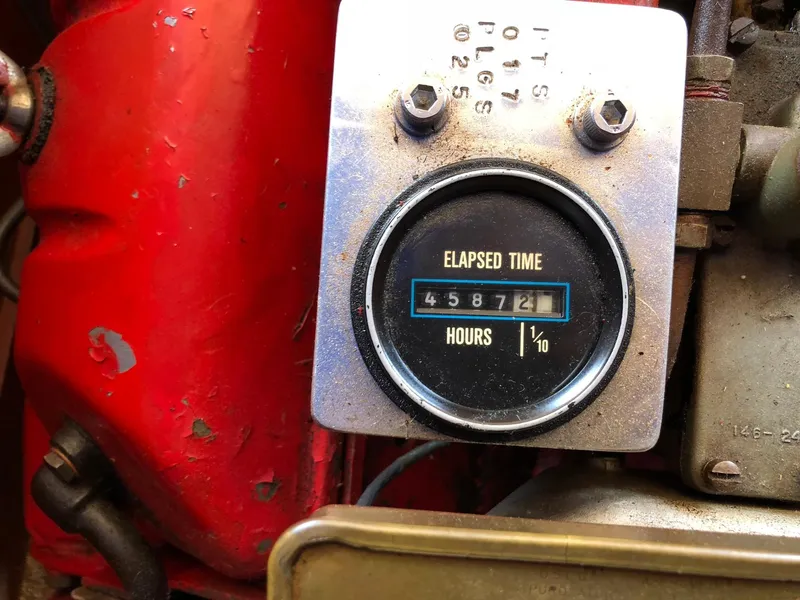 Slide: The Image of 1962 Lyman 245 engine hour meter displaying 4587.2 hours elapsed time. - 17