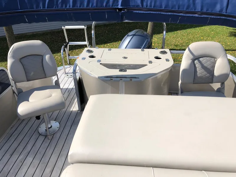 Slide: The Image of 2015 South Bay 522 FCR pontoon boat interior with seating and helm station. - 10