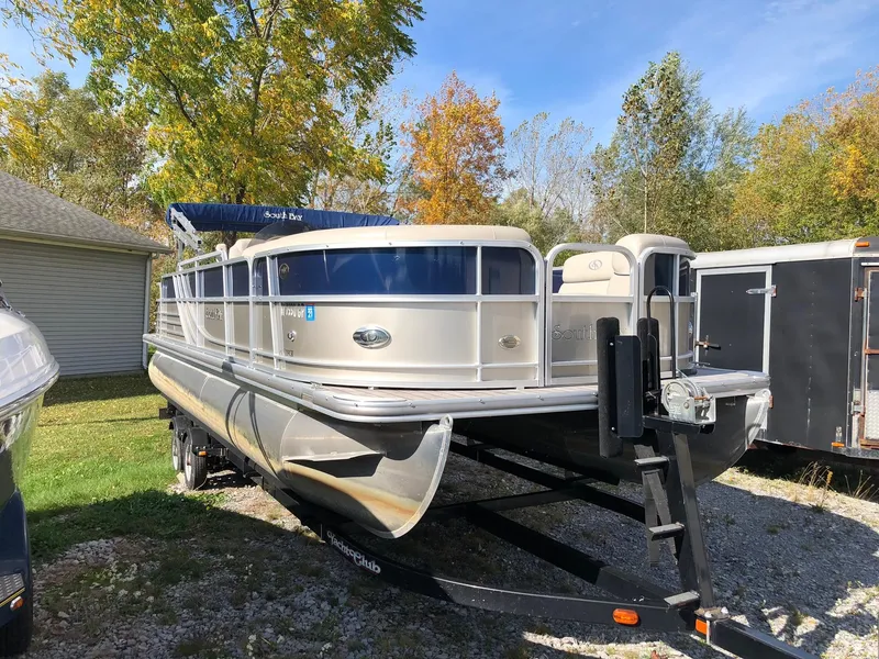 Slide: The Image of 2015 South Bay 522 FCR pontoon boat on trailer, parked outdoors. - 2