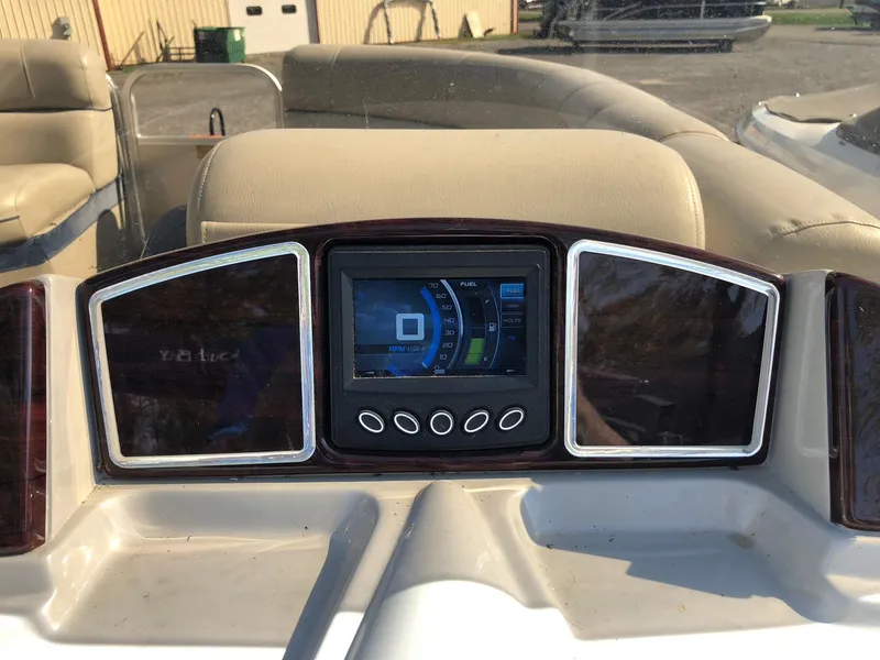 Slide: The Image of Dashboard of a 2015 South Bay 522 FCR boat with digital display and controls. - 9