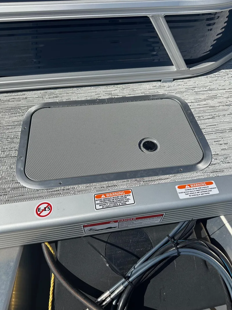 Slide: The Image of 2025 Bennington 20 SL Family boat deck with privacy room, featuring safety warnings. - 13