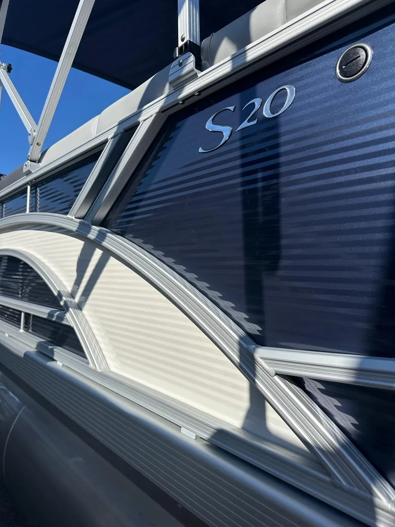 Slide: The Image of 2025 Bennington 20 SL Family pontoon boat with privacy room, featuring sleek design and S20 model marking. - 14