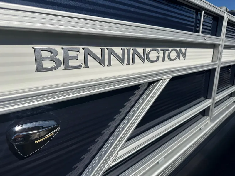 Slide: The Image of 2025 Bennington 20 SL Family pontoon boat with privacy room, close-up of logo and design. - 23