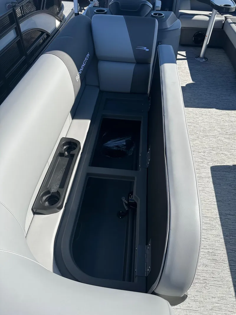 Slide: The Image of 2025 Bennington 20 SL Family boat interior with storage compartment and seating. - 27