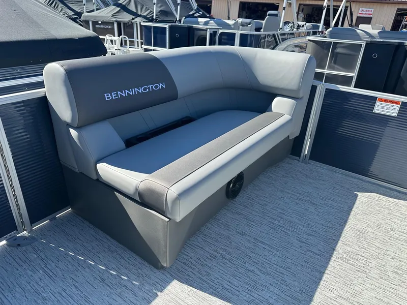 Slide: The Image of 2025 Bennington 20 SL Family boat seating with privacy room, featuring sleek gray upholstery. - 28