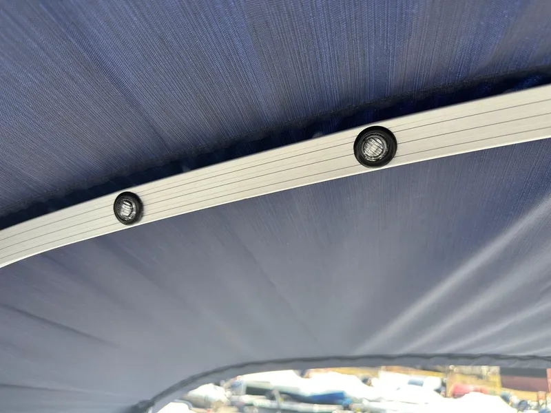 Slide: The Image of Close-up of Bennington 20 SL Family boat canopy with integrated lights, 2025 model. - 34