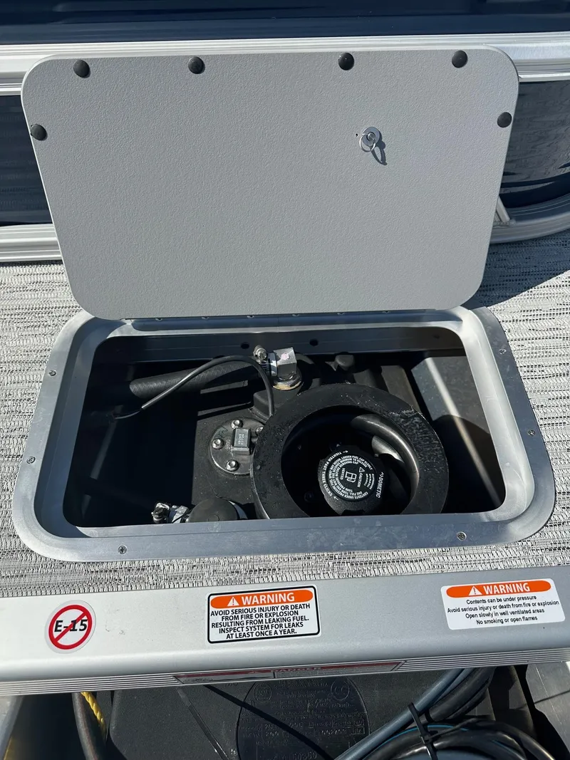 Slide: The Image of Fuel compartment of 2025 Bennington 20 SL Family boat with safety warnings. - 36