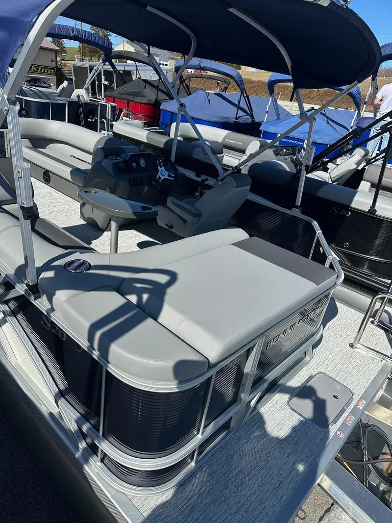 Slide: The Image of 2025 Bennington 20 SL Family pontoon boat with privacy room, featuring spacious seating and canopy. - 37