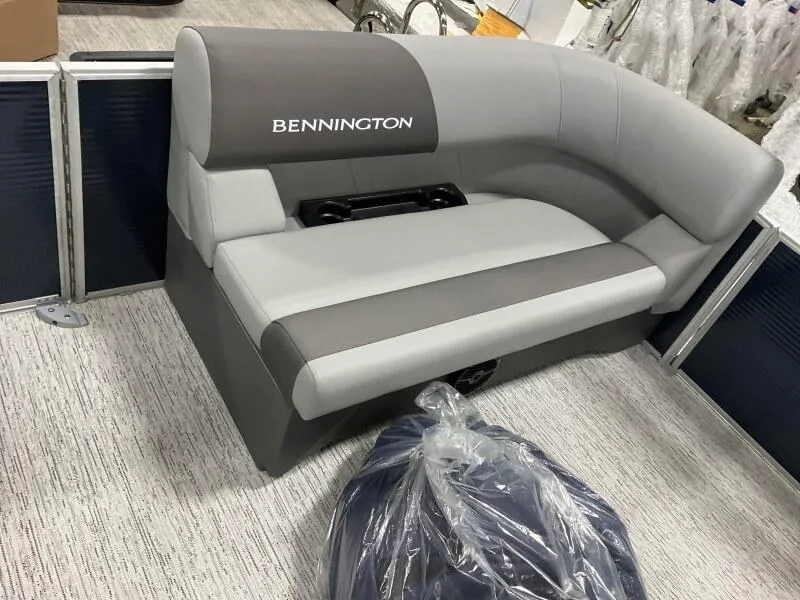 Slide: The Image of 2025 Bennington 20 SL Family boat seating with privacy room, featuring gray upholstery. - 41