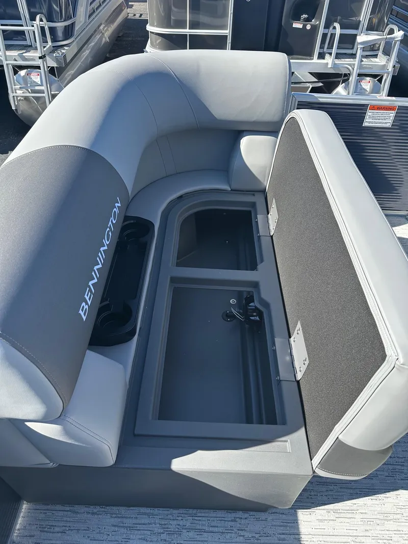 Slide: The Image of 2025 Bennington 20 SL Family boat seat with open storage compartment. - 5