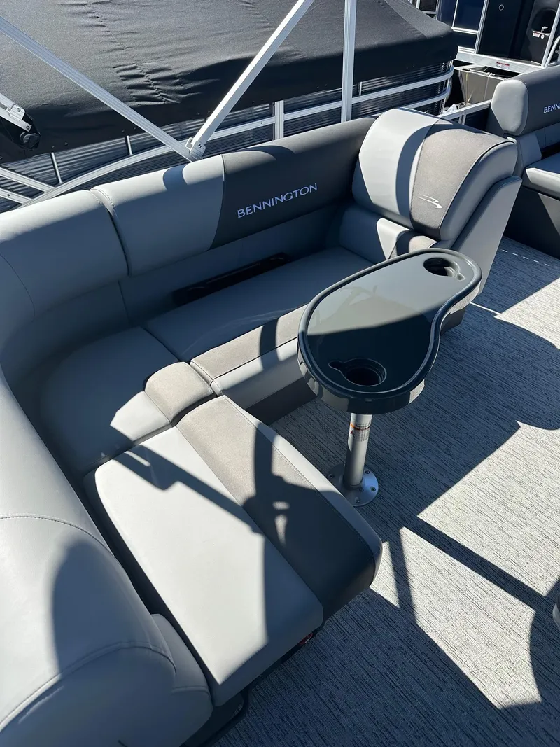 Slide: The Image of 2025 Bennington 20 SL Family pontoon seating with privacy room, featuring a sleek gray design. - 8