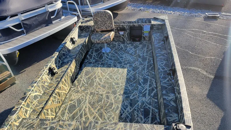 Slide: The Image of 2025 Smoker Craft Sportsman 1660 tiller boat in Mossy Oak Camo, featuring a single seat. - 10